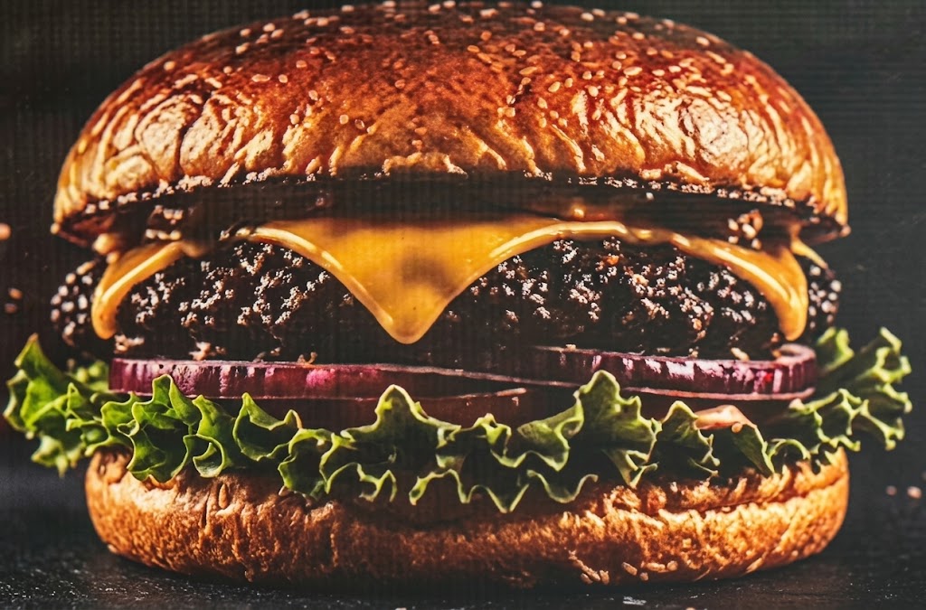 Smashed hamburguesa Mexicali with melted cheese, jalapeños, and chipotle crema