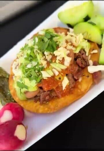Tacos La Gorda — loaded tostada