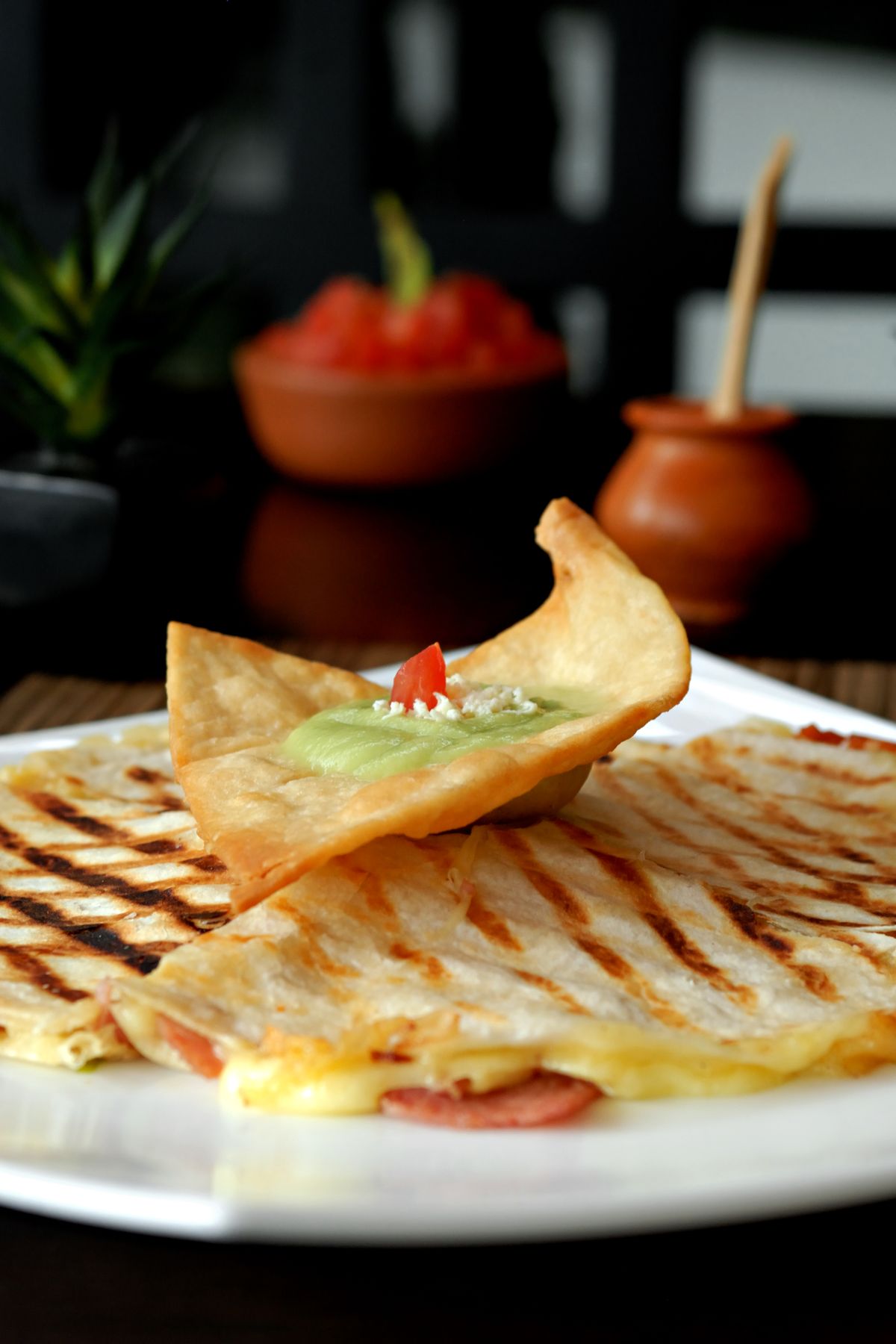 Grilled quesadillas served with salsa and guacamole